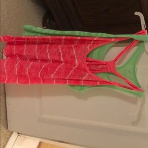 Green and pink gym tanks